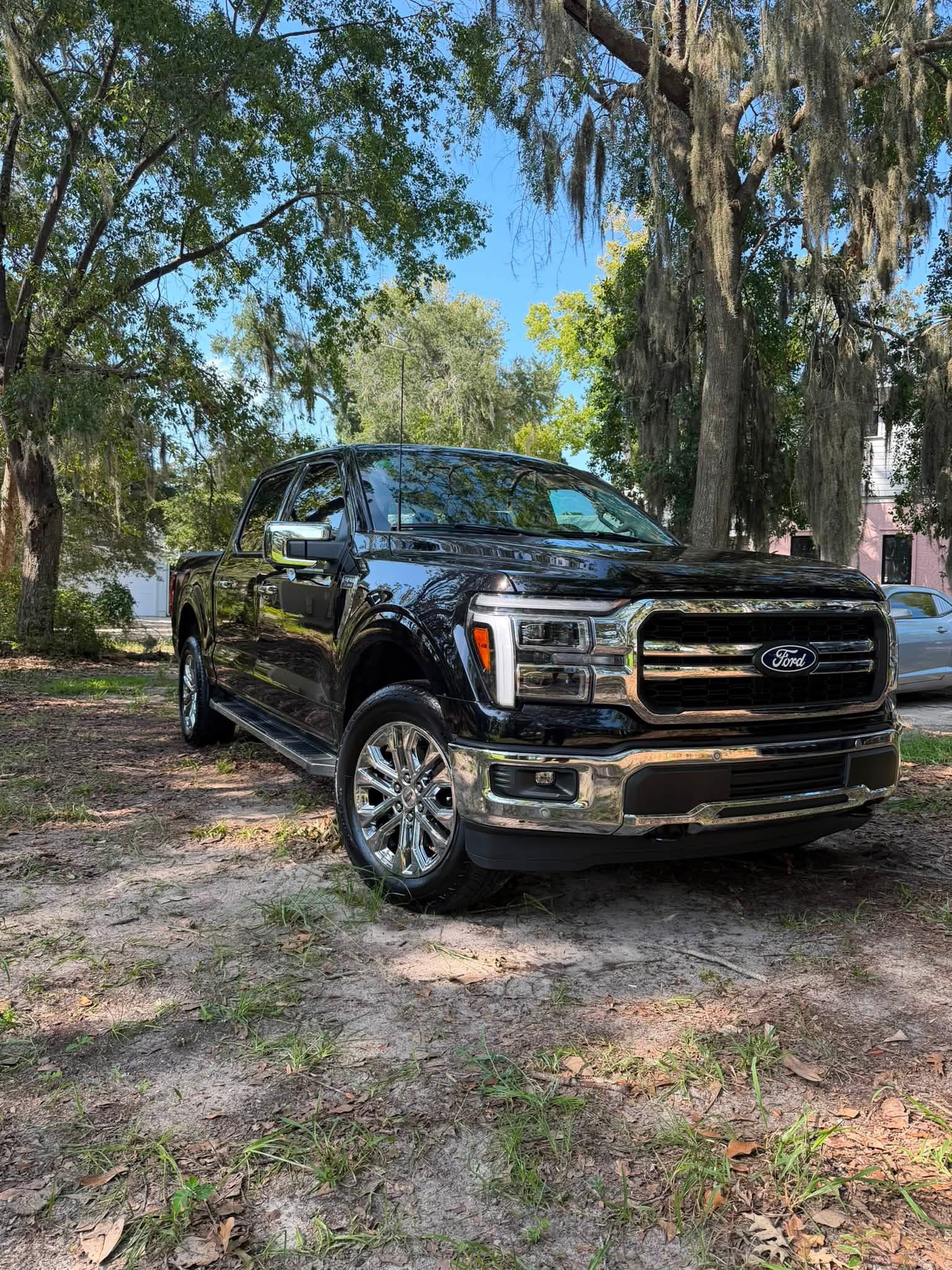 Black pickup parked outdoors following vehicle work