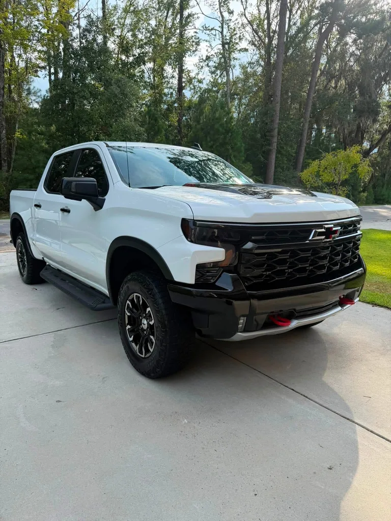 White Chevrolet pickup on a driveway